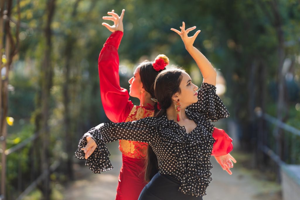 Inicio 2 Pair of female flamenco dancers performing a choreography outdoors