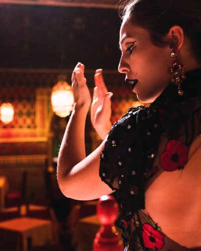 Woman clapping hands and dancing on scene Woman clapping hands and dancing on scene